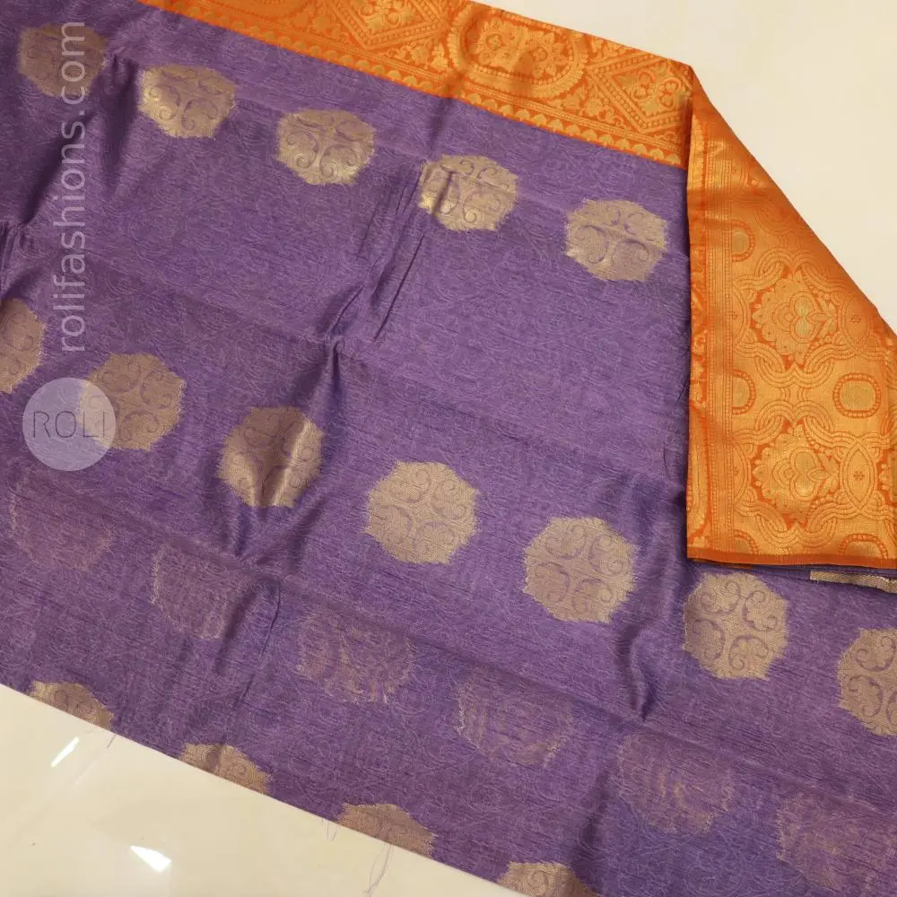 A fancy saree with shell brooch and embroidery hybrid designer blouse