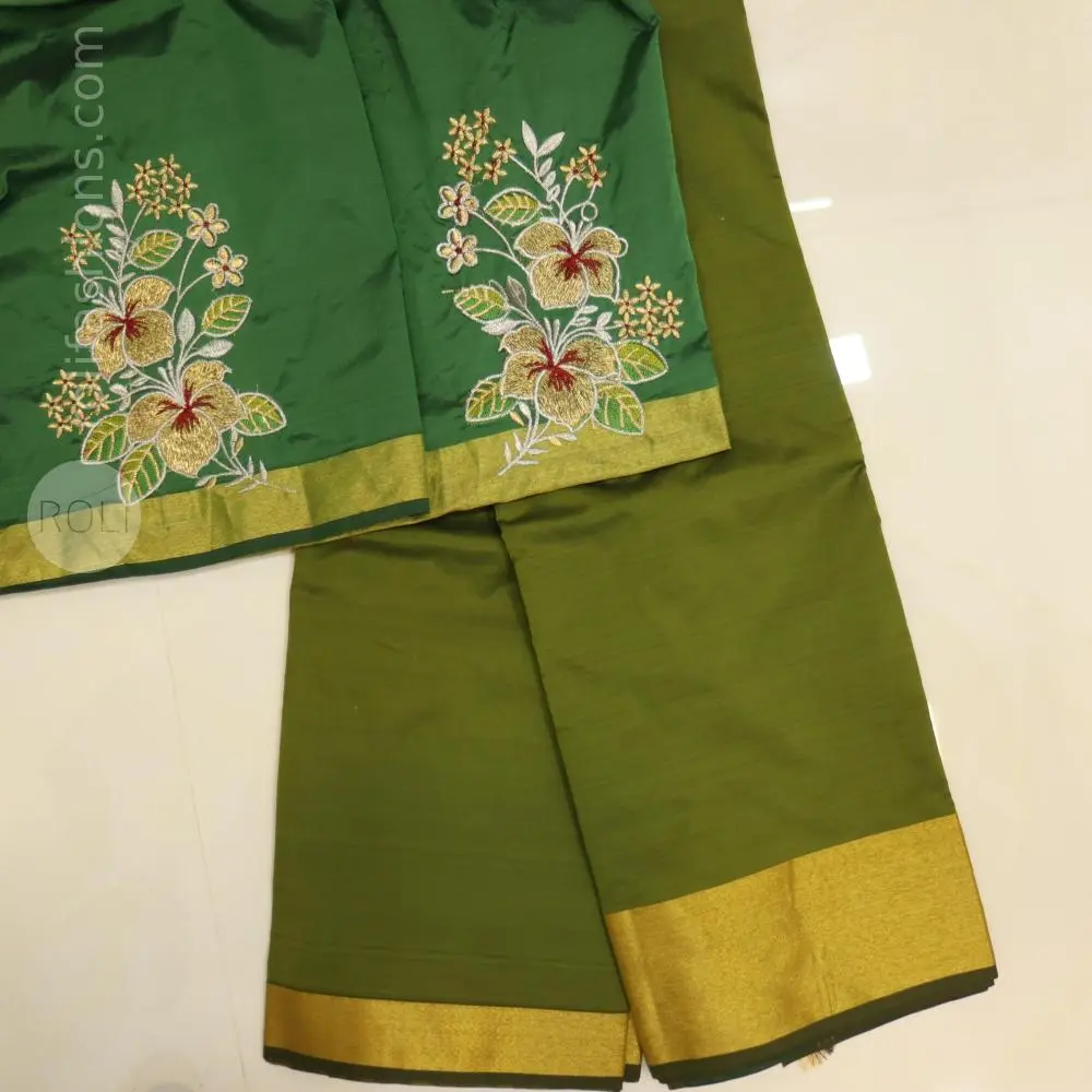 Light green saree with bottle green blouse and pallu