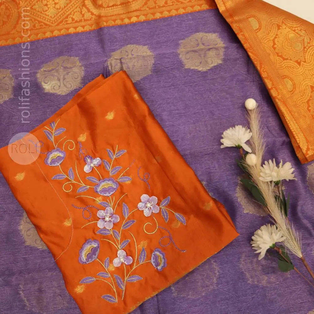 A fancy saree with shell brooch and embroidery hybrid designer blouse