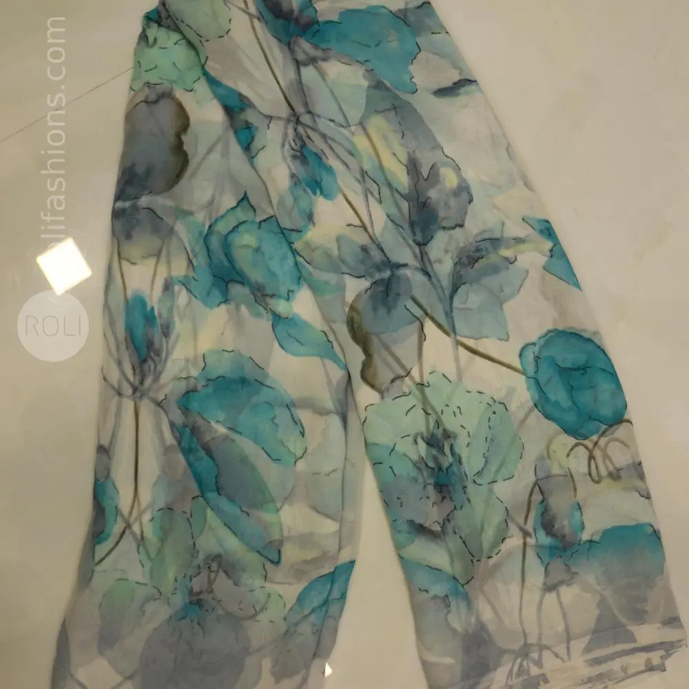 Different shades of blue flowers on a white base saree