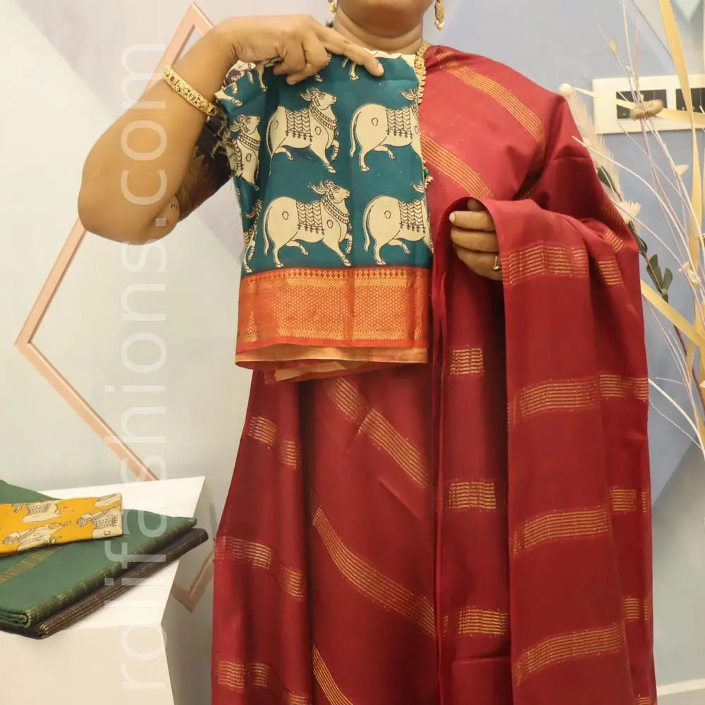 Maroon tusser saree with Prussian chennuri silk blouse