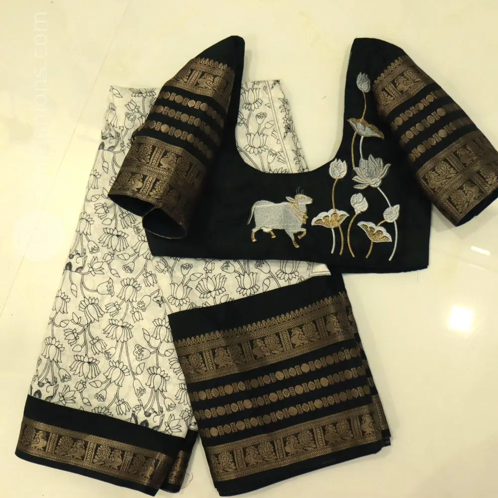 Stunning celebrity black with white saree