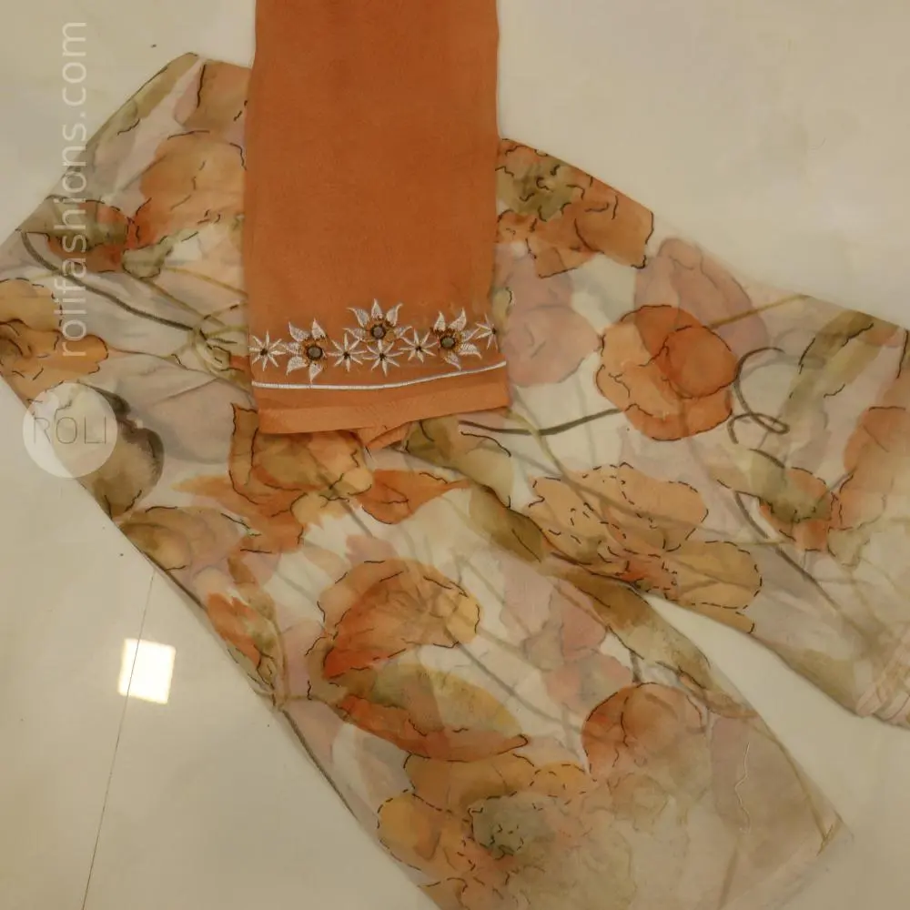 Different shades of brown flowers on a white base saree