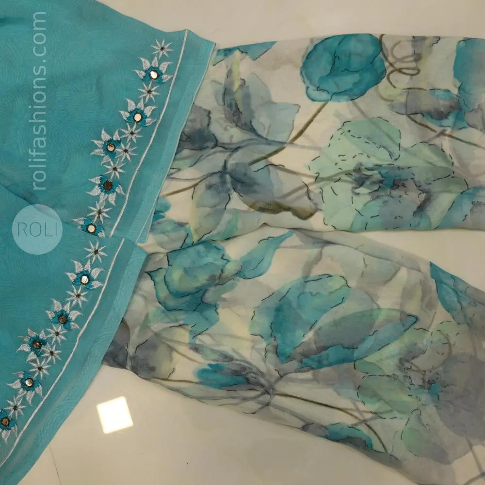 Different shades of blue flowers on a white base saree