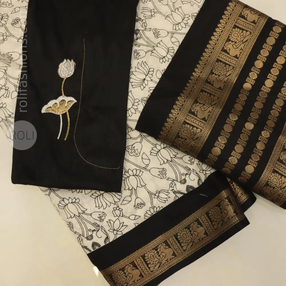 Stunning celebrity black with white saree