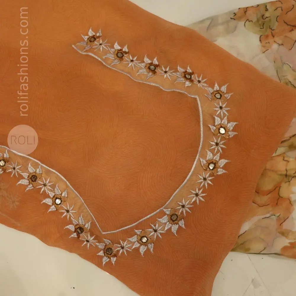 Different shades of brown flowers on a white base saree