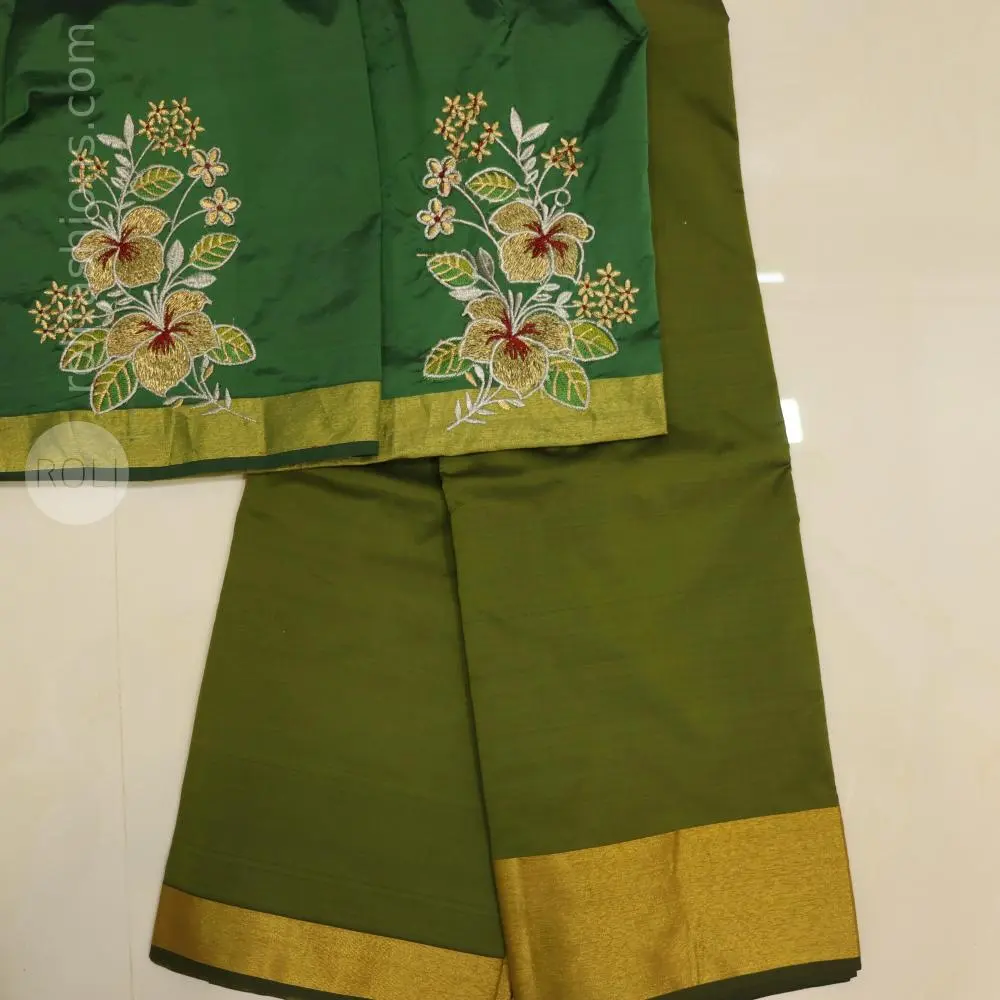 Light green saree with bottle green blouse and pallu