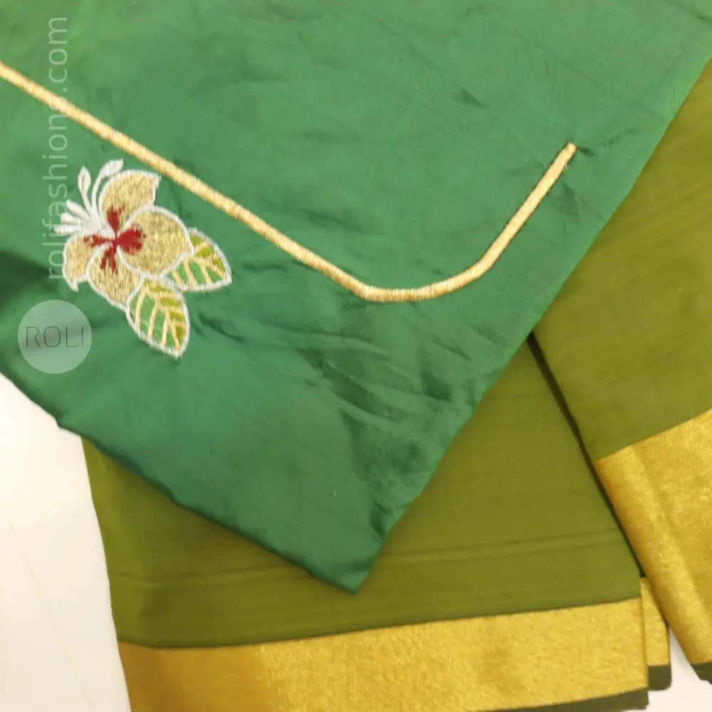 Light green saree with bottle green blouse and pallu