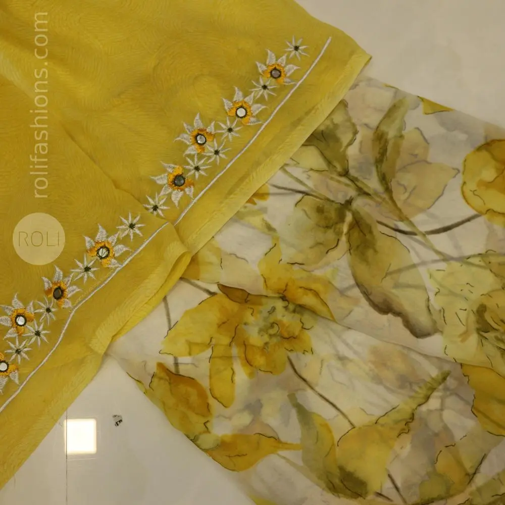 Different shades of yellow  flowers on a white base saree