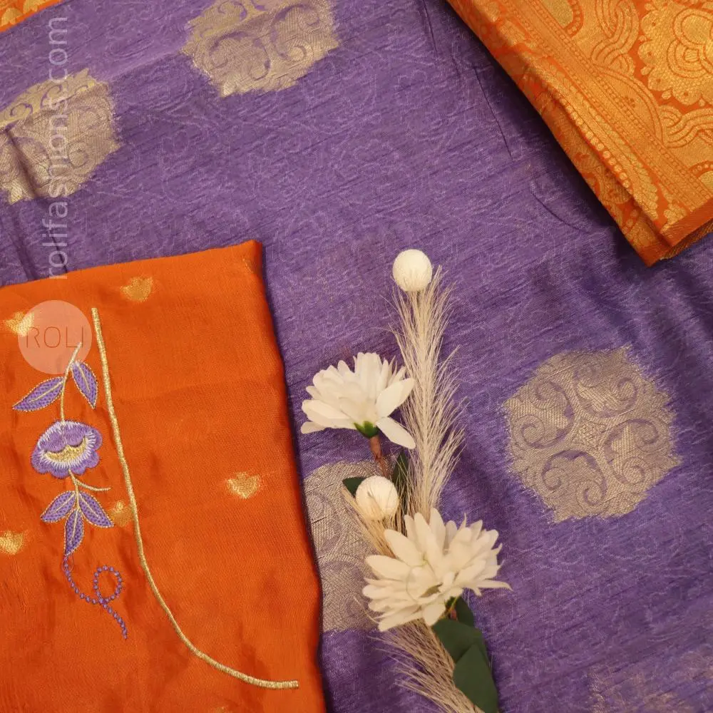 A fancy saree with shell brooch and embroidery hybrid designer blouse