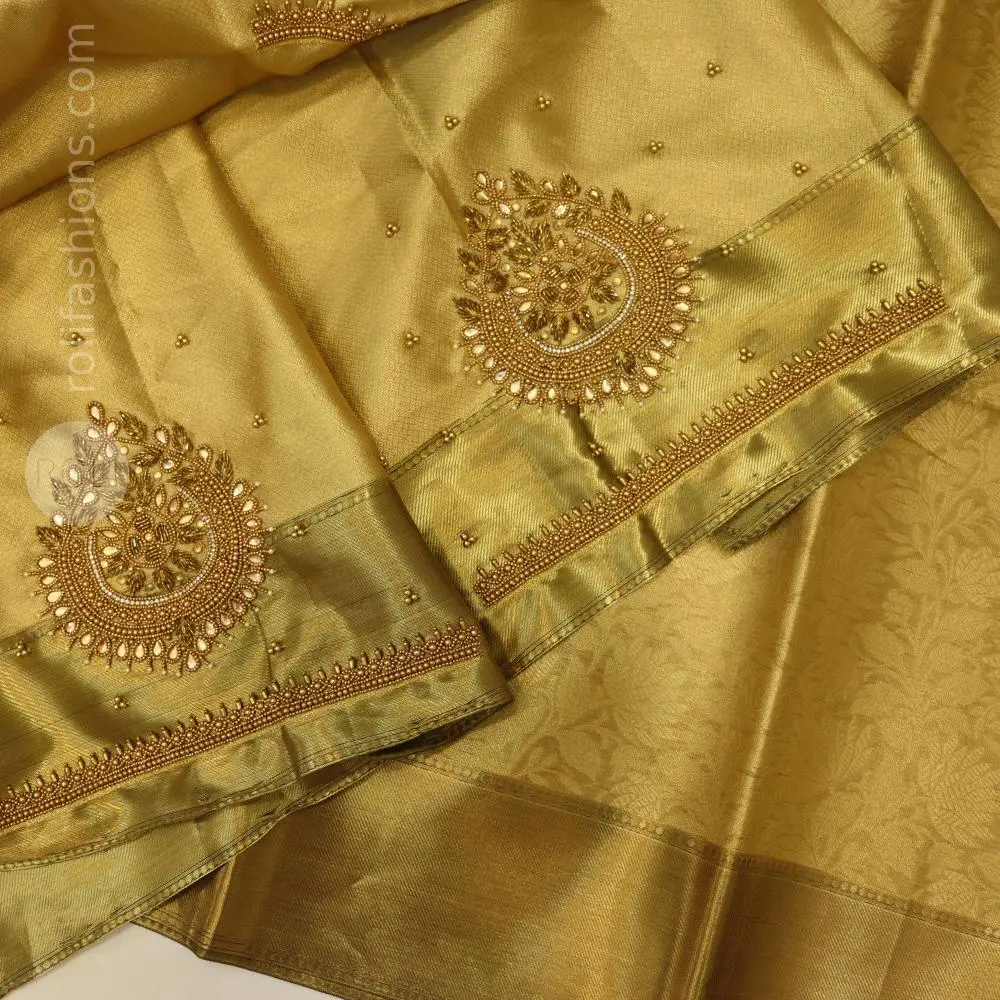 Golden angelic celebrity inspired saree with trendy aari work blouse