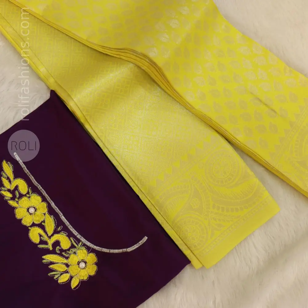 Yellow saree with deep purple blouse