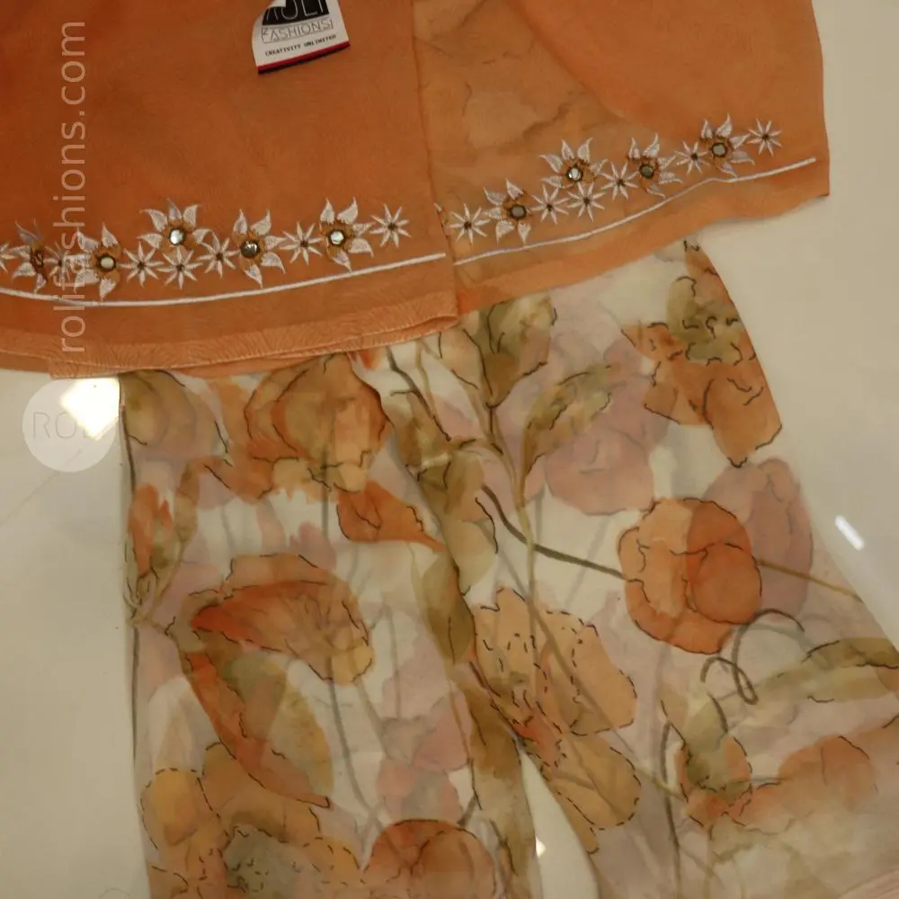 Different shades of brown flowers on a white base saree