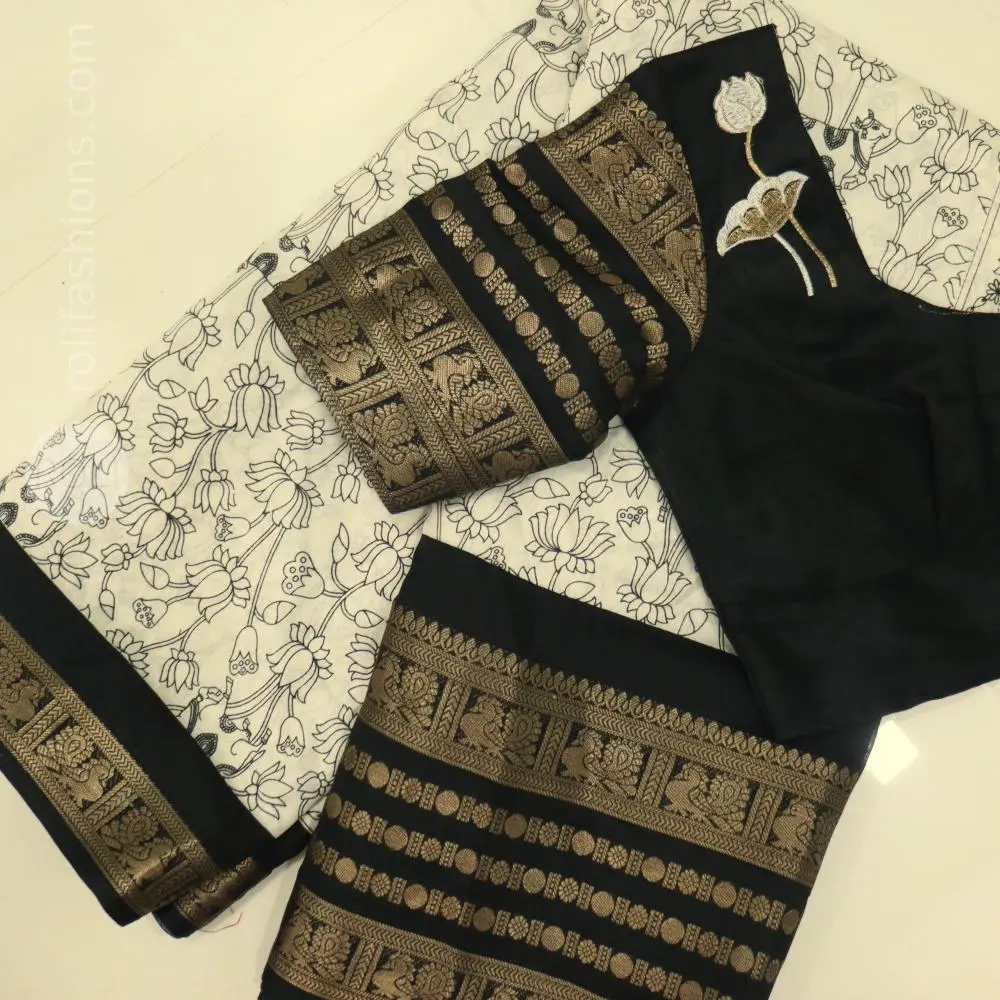 Stunning celebrity black with white saree