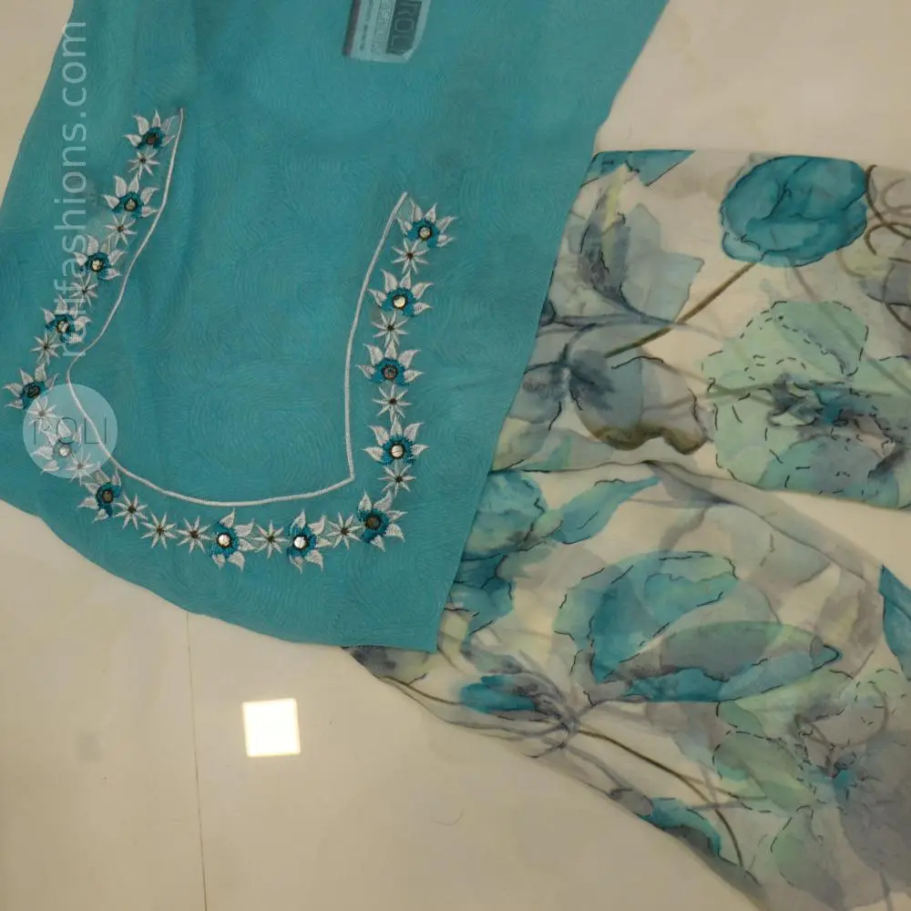Different shades of blue flowers on a white base saree
