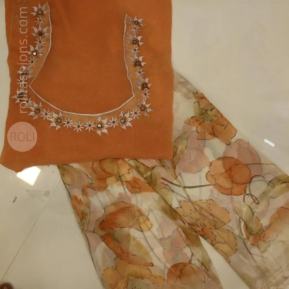 Different shades of brown flowers on a white base saree