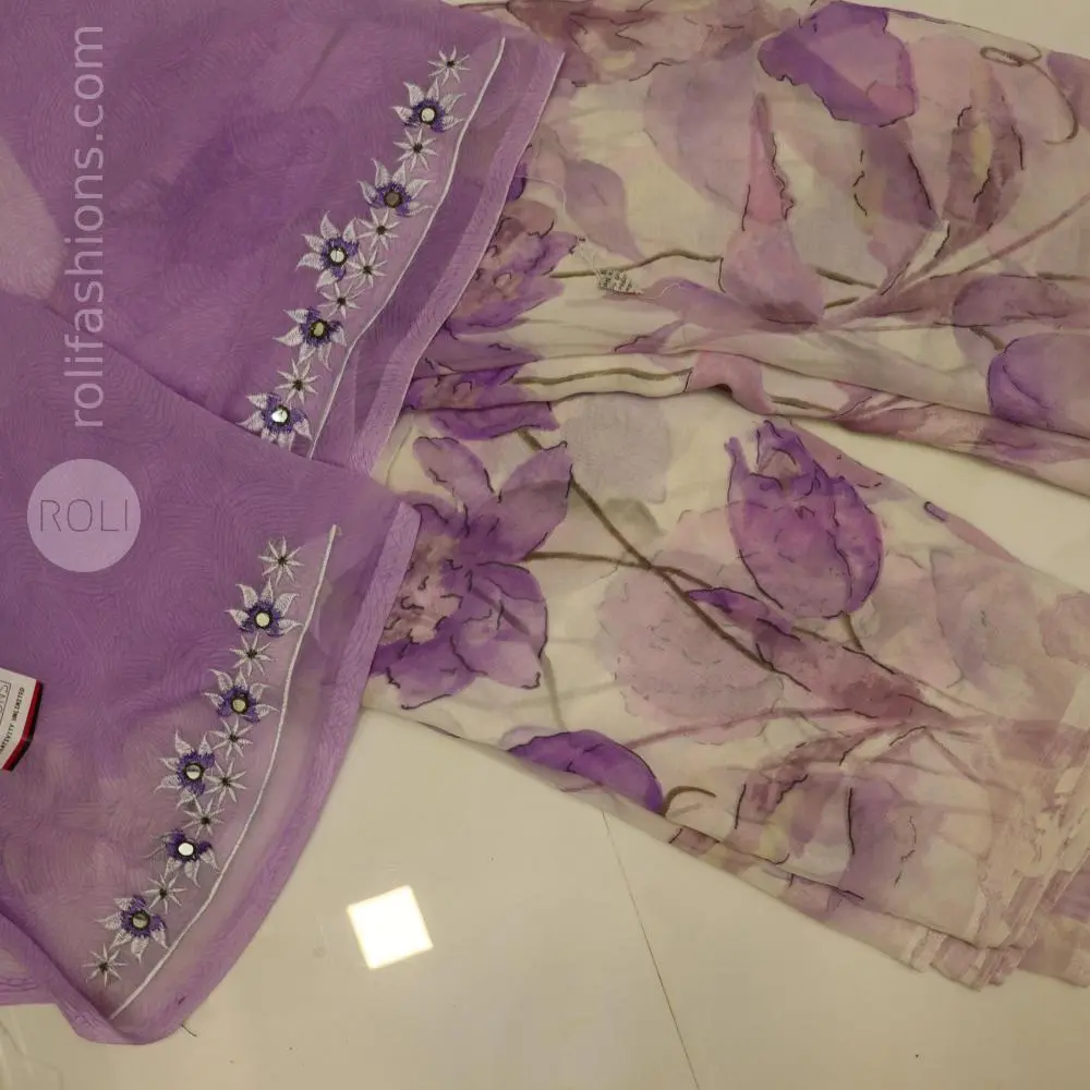 Different shades of purple flowers on a white base saree