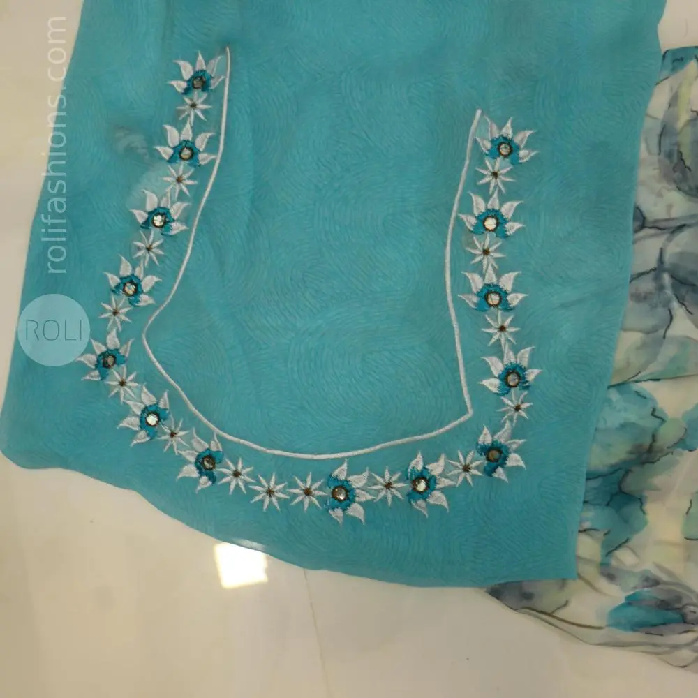 Different shades of blue flowers on a white base saree