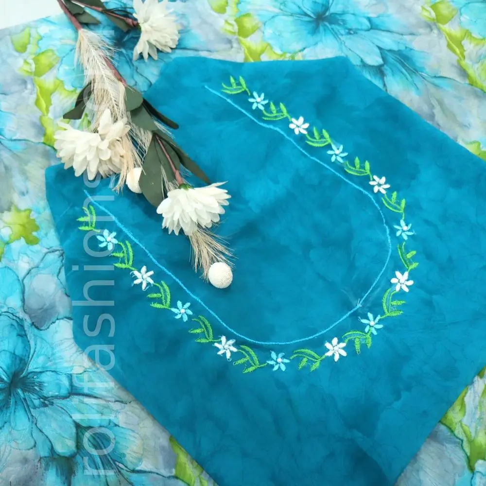 Teal blue and Misty grey flowral prints gently embedded with pastel green 