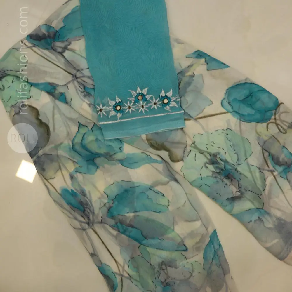 Different shades of blue flowers on a white base saree